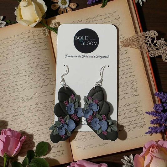 Black Butterfly Statement Earrings with purple and blue flowers