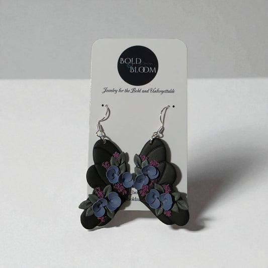 Black Butterfly Statement Earrings with purple and blue flowers
